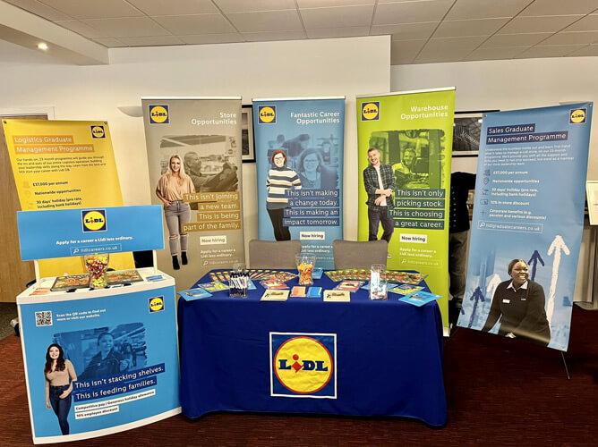 Exhibitor stand with branded tablecloths